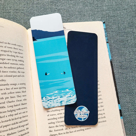 Bookmark showing two surfers sitting on their boards waiting for waves – surf design by Chloe Evans