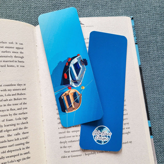Illustrated bookmark featuring two colourful boats floating in a harbour, printed on tear-proof paper – design by Chloe Evans