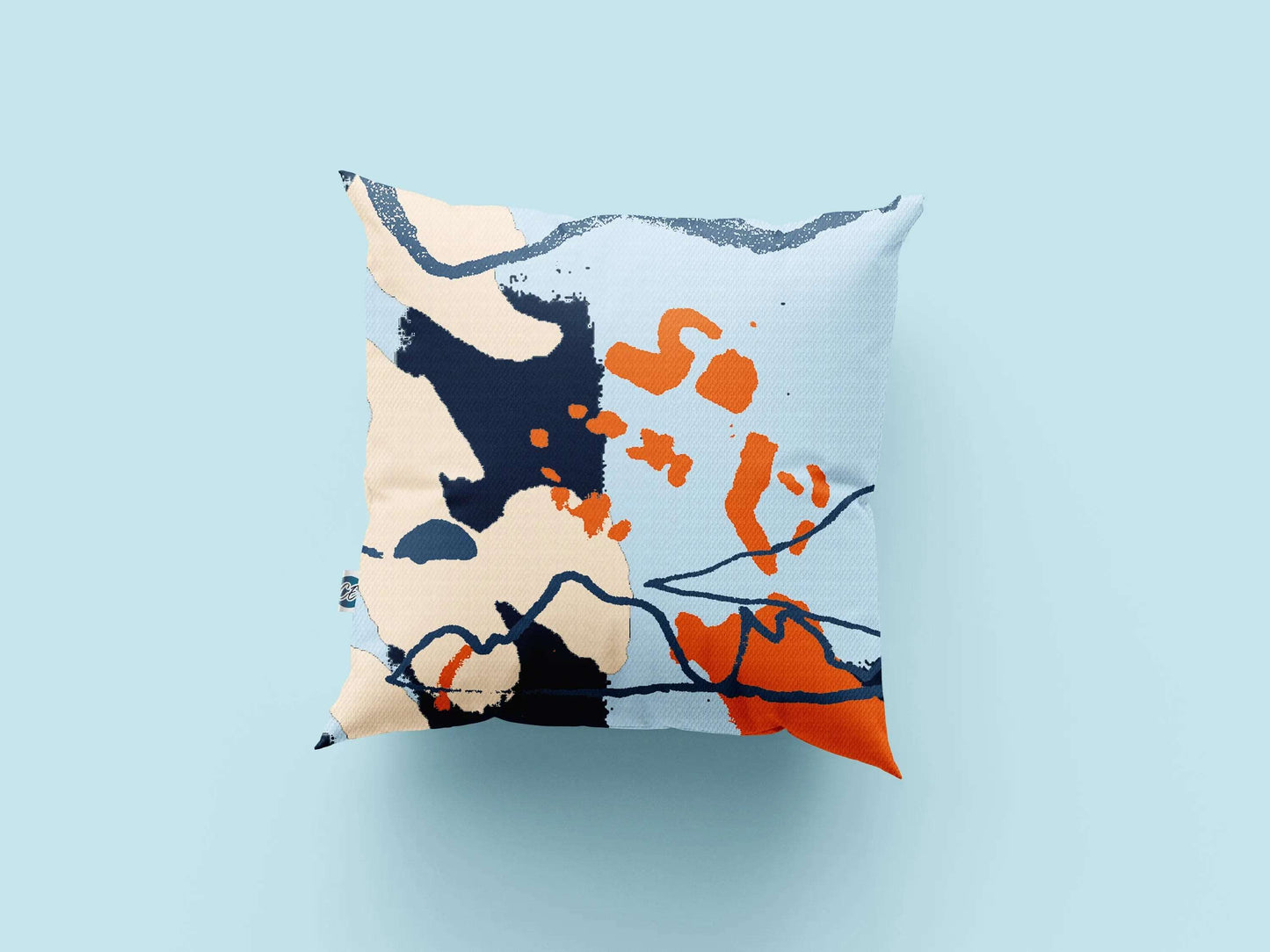 Digital mockup of blue and orange abstract printed cotton cushion