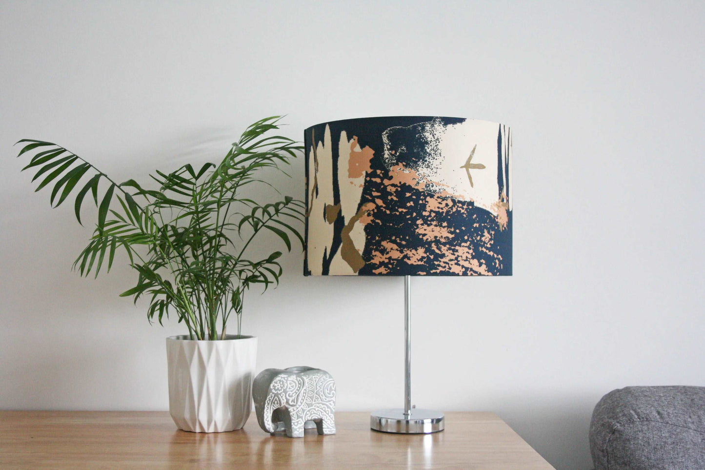 Photo of 30cm blue and pink abstract print handmade lampshade on silver table lamp, on wooden table with plant and home accessories