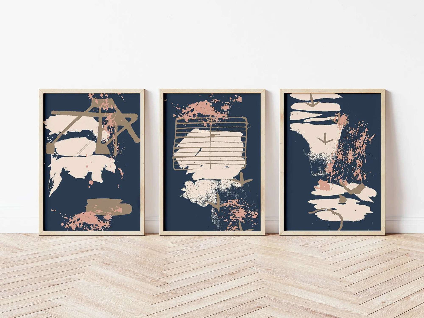 Digital mockup of blue grey and pink abstract coastal triptych print set in wooden frames