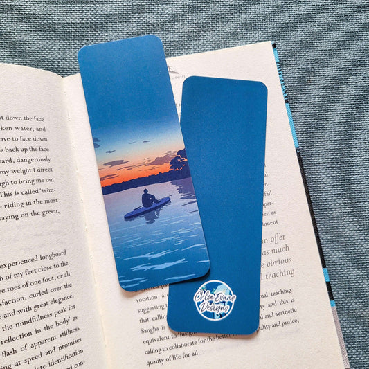 A sunset paddleboarder bookmark for lovers of the sea and slow evenings. Tear-proof and double-sided – designed in the UK by Chloe Evans.