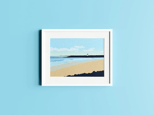 Blue and cream print of Burry Port lighthouse and beach in a white frame on a blue wall