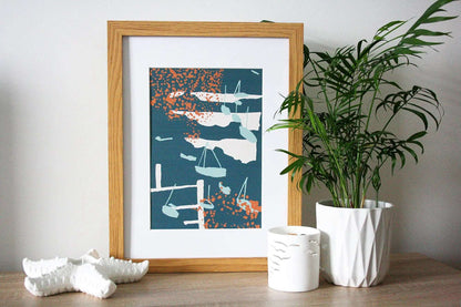 Photo of green and orange Coastal Journey 13 abstract A4 print in wooden frame with white tealight holders and house plant