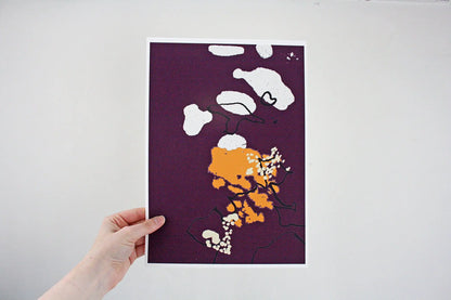 Photo of hand holding purple and yellow Coastal Journey 8 abstract A4 print