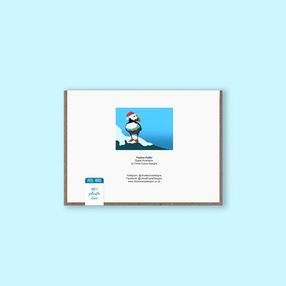 The back of a Christmas greeting card showing the design thumbnail of a puffin in a Santa hat with business details for Chloe Evans Designs