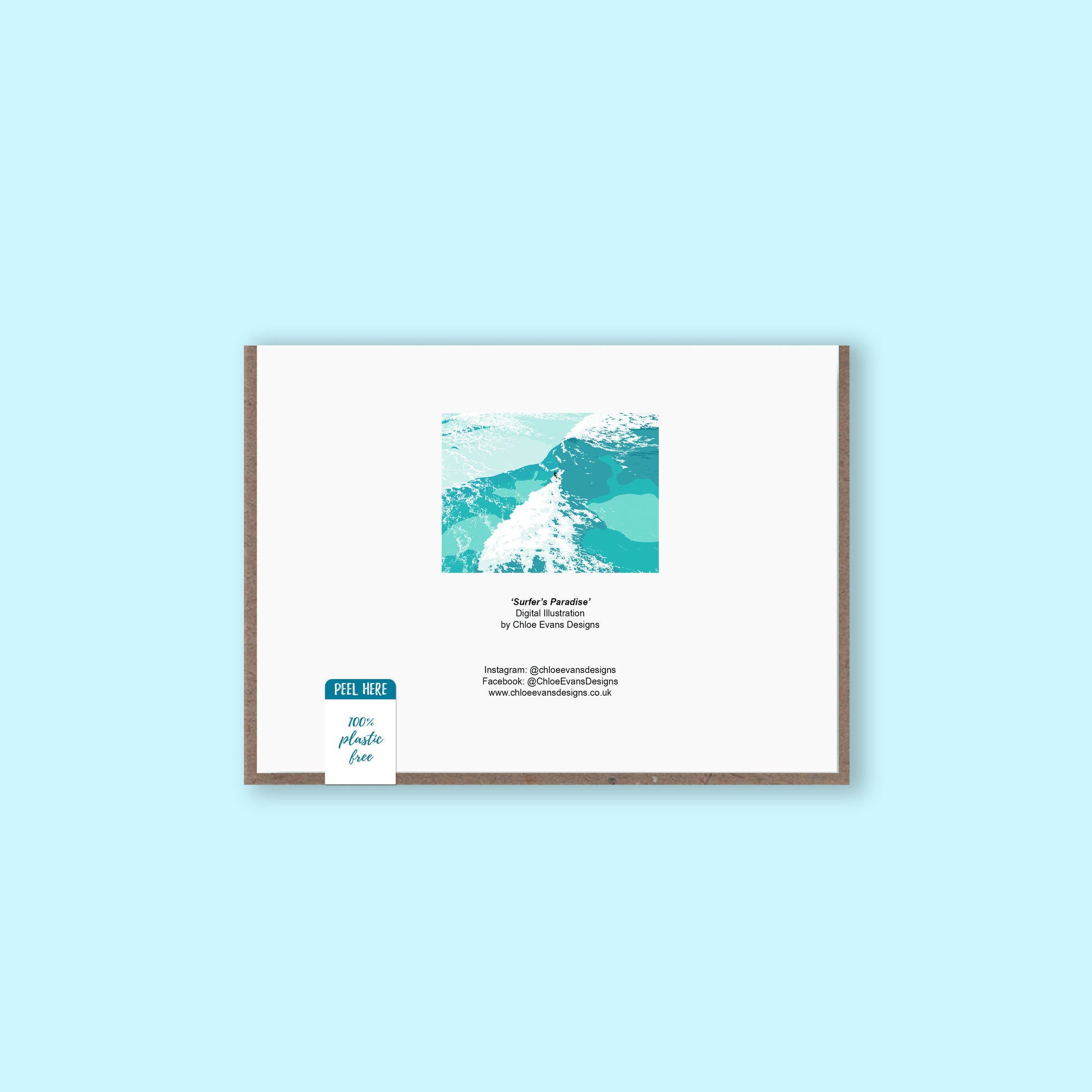 A mockup of the back of a greeting card showing the illustration of a surfer riding a wave that's on the front with business details, with a brown envelope behind and a removable plastic-free sticker, on a light blue background.