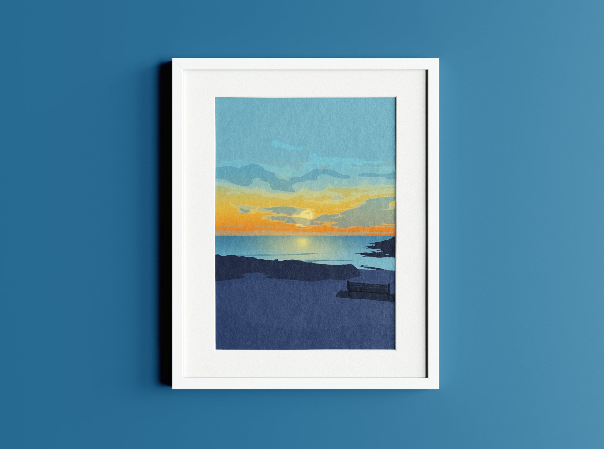 Mockup of Limeslade Bay Sunset Illustration in white frame on dark blue background.