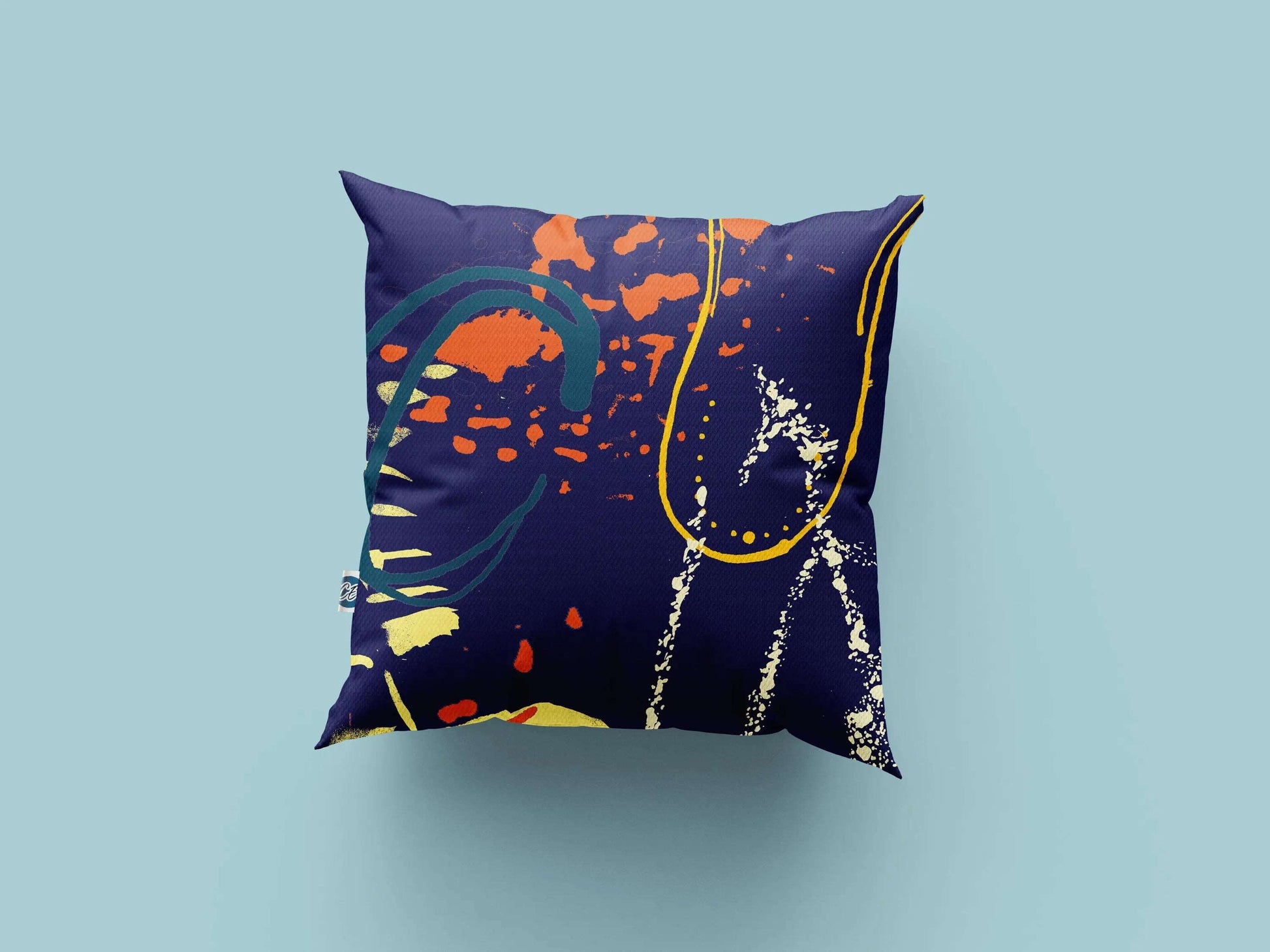 Digital mockup of navy, yellow and orange abstract print handmade cotton cushion