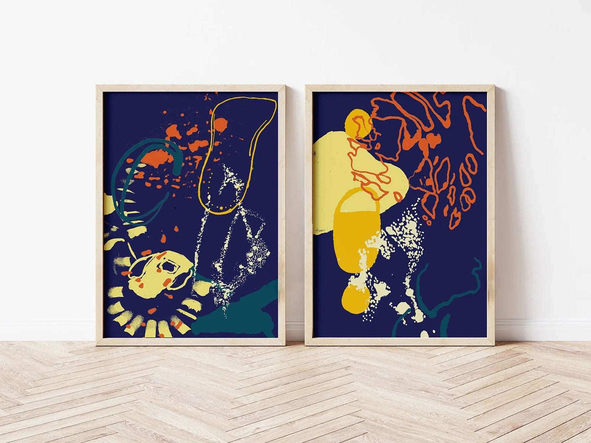 Digital mockup of navy, yellow and orange abstract coastal diptych print set in wooden frames