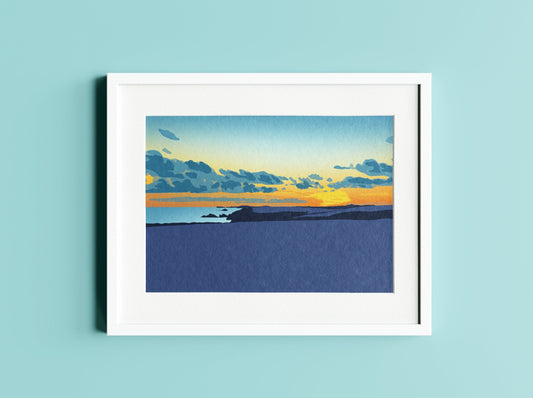 A mock up of an illustration of Newgale beach at sunset in a white frame on a light blue background.