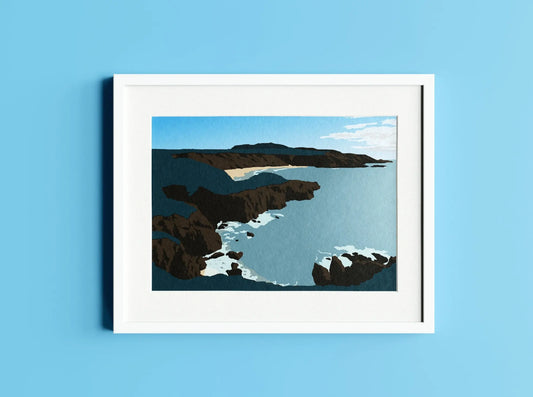 Digital mock up of Porthor Whistling Sands print in frame on blue wall backdrop