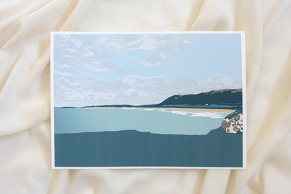 Photo of green Rhossili beach illustration print on cream fabric backdrop