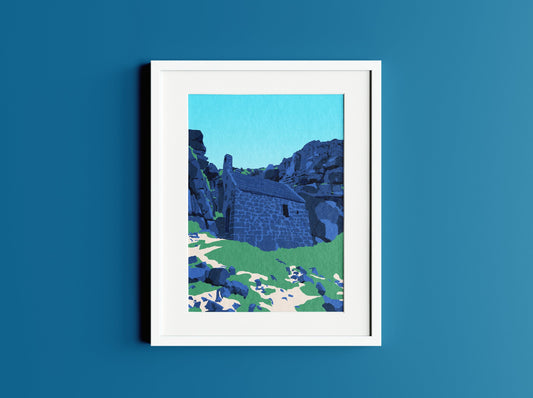 Mock up of St Govan's Chapel illustration in a white frame one a dark blue wall.