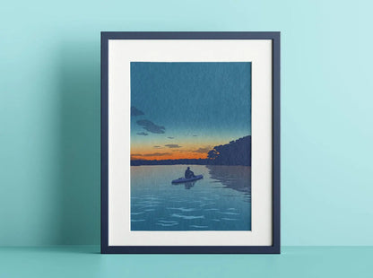 An illustration of a paddleboarder watching the sunset, framed in a dark blue frame on a light blue background.