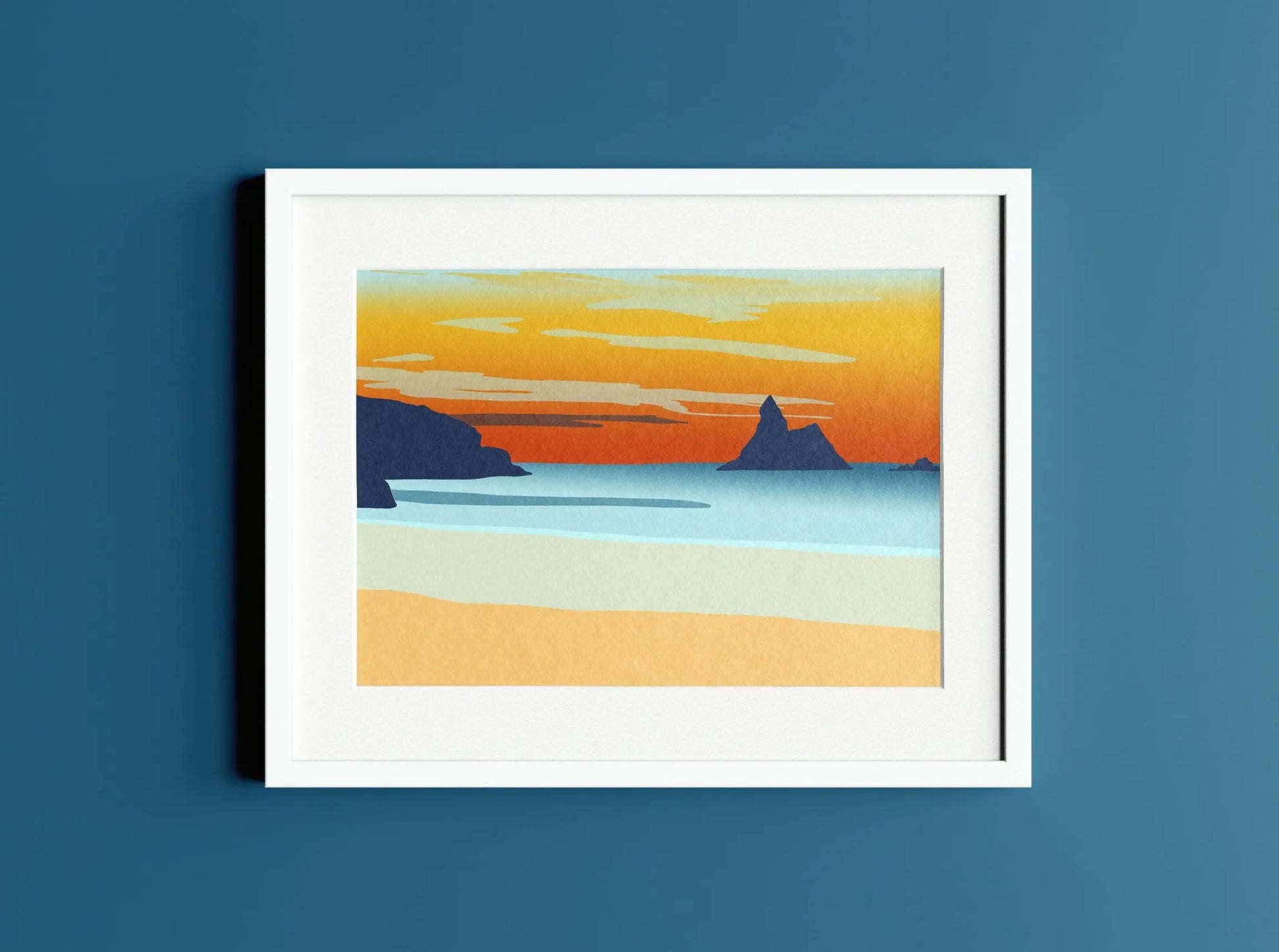 Digital mockup of Broad Haven South beach sunset print in white frame on dark blue wall backdrop