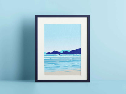 A blue print of a paddle boarder surfing, in a navy frame on a blue wall