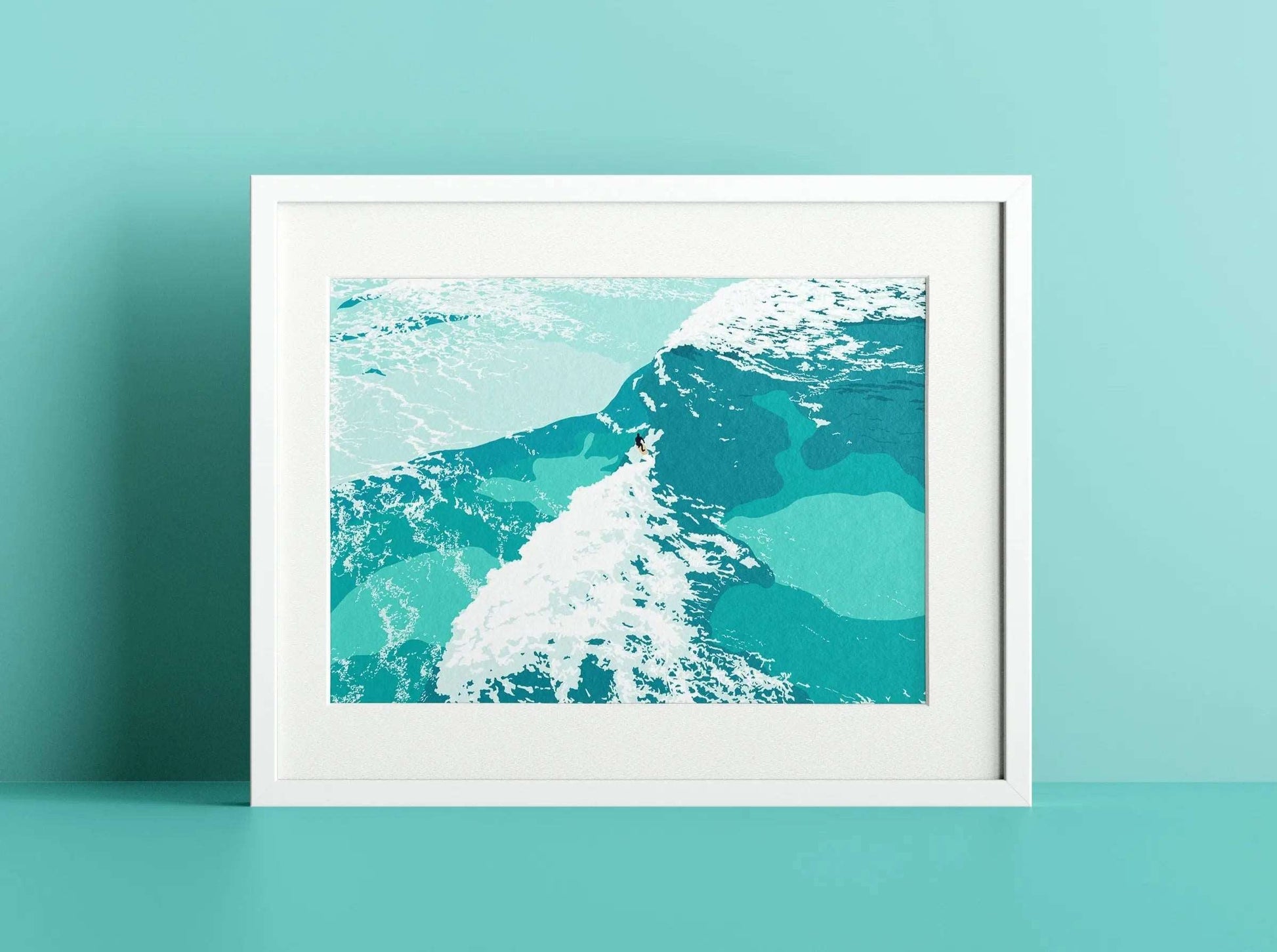 A print of a solo surfer surrounded by blue ocean and white water, in a white frame on a blue wall