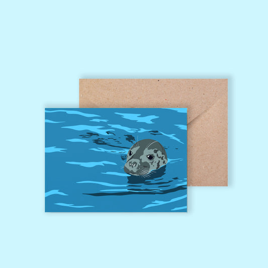 Greeting card featuring an illustrated seal popping its head out of the water, by Chloe Evans Designs