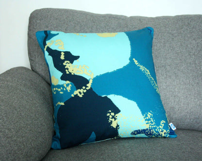 Photo of 45cm teal and blue abstract printed cotton handmade cushion on grey sofa