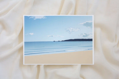 Photo of blue Swansea bay print on cream fabric backdrop